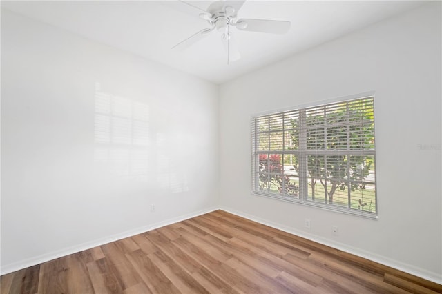 unfurnished room featuring hardwood / wood-style floors and ceiling fan