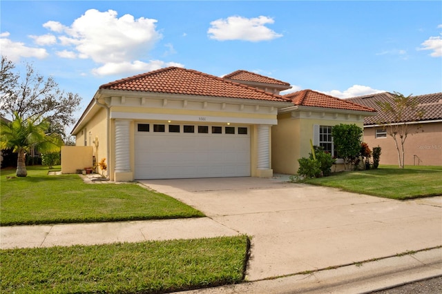 mediterranean / spanish-style house with a front lawn and a garage