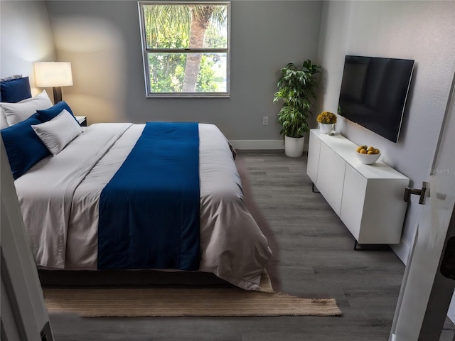 bedroom with hardwood / wood-style floors