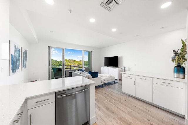 kitchen featuring white cabinets, light wood-type flooring, light stone countertops, and dishwasher