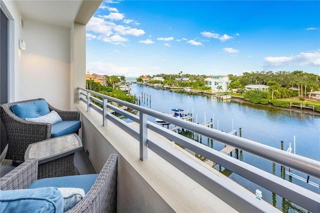 balcony featuring a water view