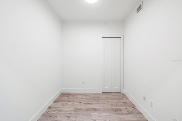 unfurnished room featuring light wood-type flooring