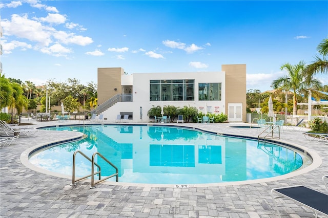 view of swimming pool with a patio