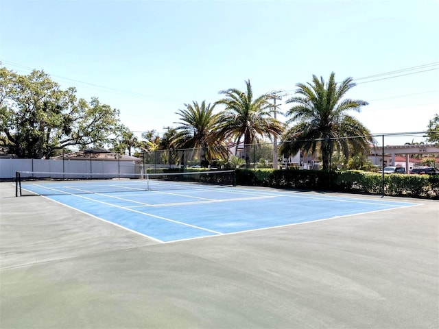 view of tennis court with fence