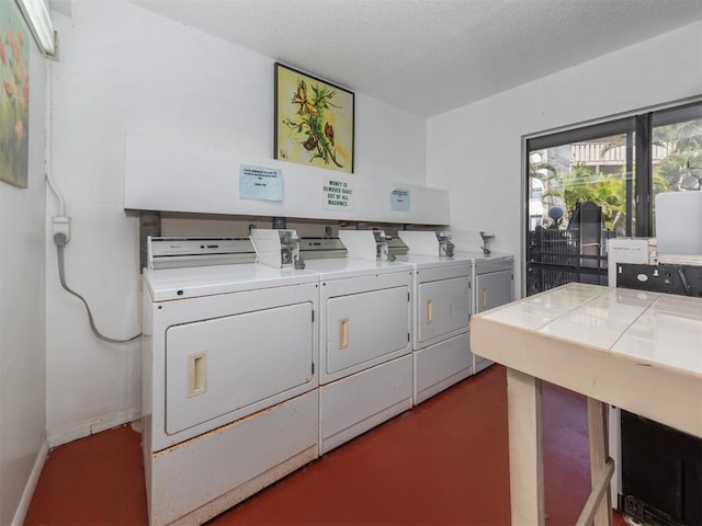 community laundry room with separate washer and dryer