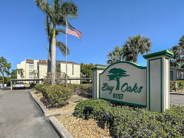 community sign with covered parking