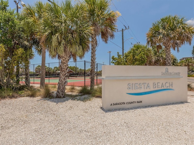 community sign with fence