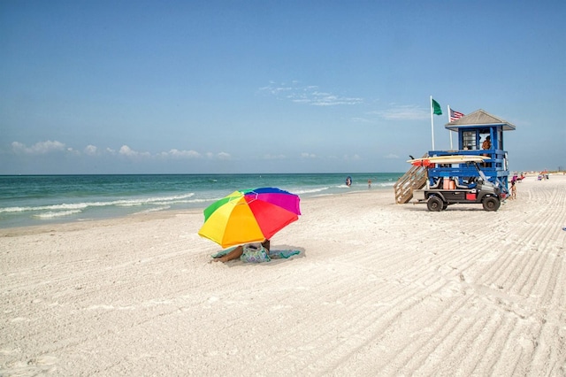 property view of water featuring a beach view