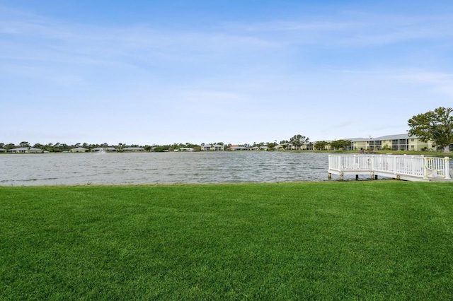 exterior space featuring a water view and a yard