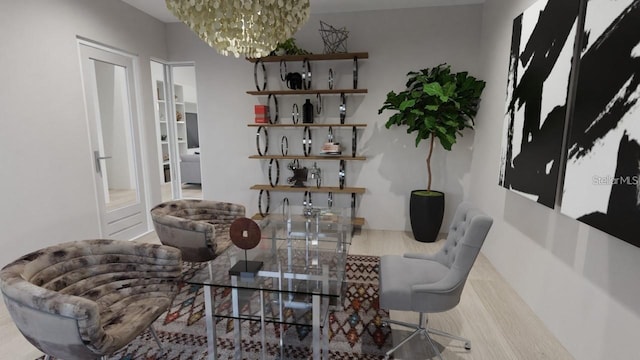 dining area with wood-type flooring and a notable chandelier