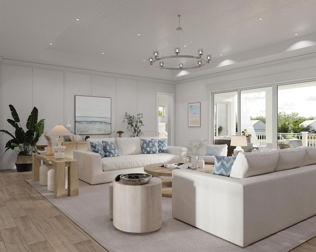 living room with crown molding, light hardwood / wood-style flooring, and a chandelier