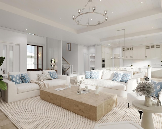 living room with an inviting chandelier and light hardwood / wood-style floors