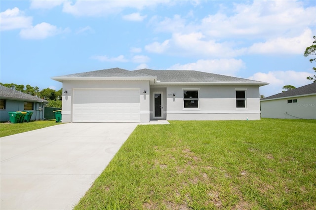 view of front facade featuring a garage and a front lawn