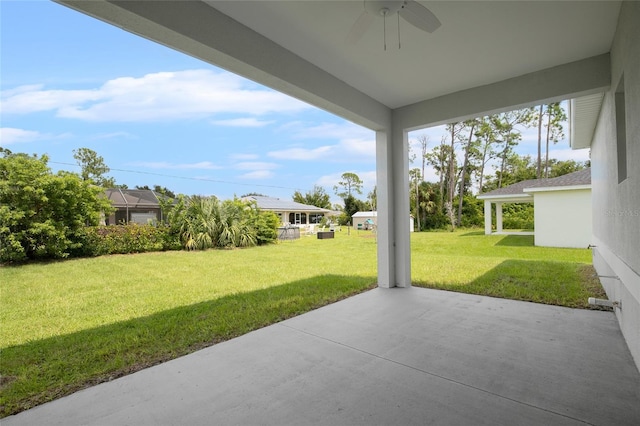 view of patio featuring ceiling fan