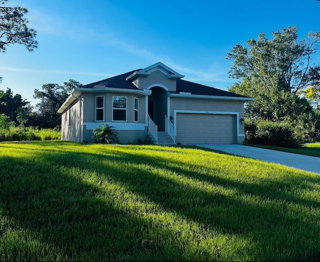 ranch-style home featuring a front lawn and a garage