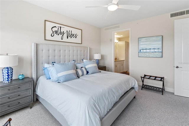 carpeted bedroom featuring connected bathroom and ceiling fan