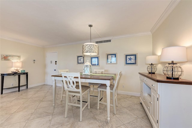 dining room featuring visible vents, crown molding, and baseboards