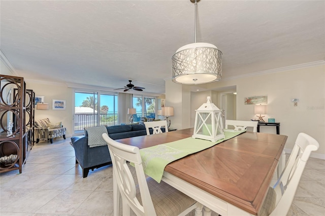 dining space featuring a ceiling fan, crown molding, baseboards, and light tile patterned floors