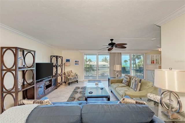 living room featuring a ceiling fan, crown molding, a textured ceiling, and light tile patterned floors