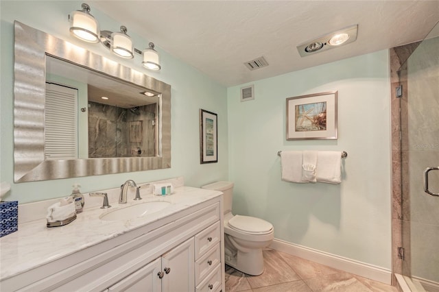 bathroom featuring a stall shower, visible vents, and baseboards