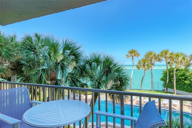 balcony featuring a water view