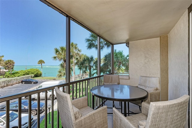 balcony featuring a water view