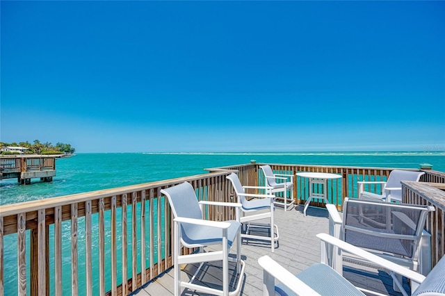 wooden deck with a water view