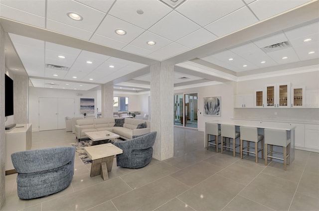 living room featuring light tile patterned floors, visible vents, and recessed lighting