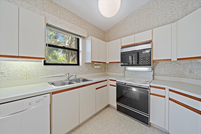 1654 Starling Dr Unit 201, Sarasota, FL 34231 - kitchen featuring range with electric cooktop, dishwasher, light countertops, black microwave, and a sink