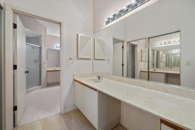 1654 Starling Dr Unit 201, Sarasota, FL 34231 - bathroom featuring a stall shower, visible vents, vanity, and tile patterned floors
