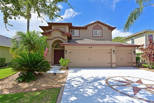 mediterranean / spanish house featuring a garage