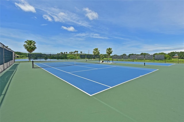 view of sport court with basketball hoop