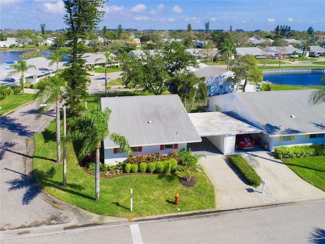 birds eye view of property featuring a residential view and a water view