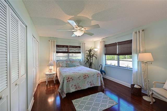 bedroom featuring ceiling fan, a textured ceiling, baseboards, and wood finished floors