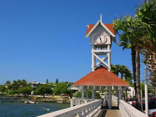 dock area with a gazebo and a water view