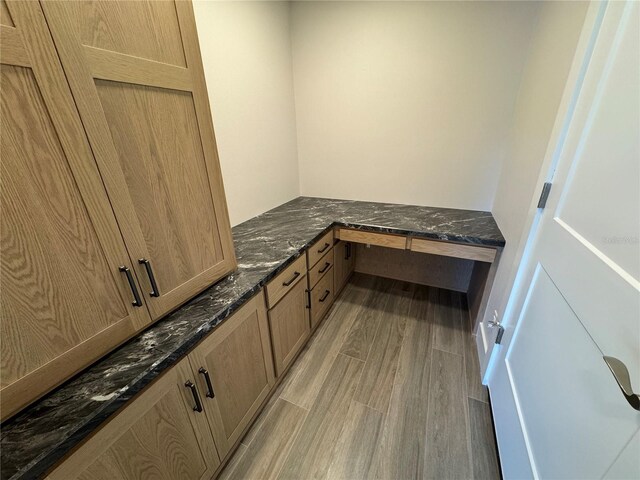 bathroom with hardwood / wood-style flooring