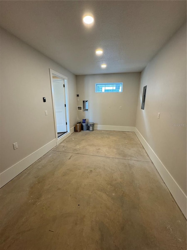 basement featuring a textured ceiling