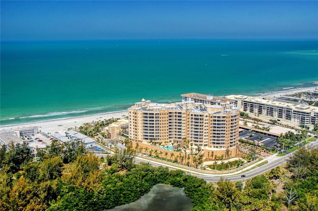 bird's eye view with a water view and a beach view