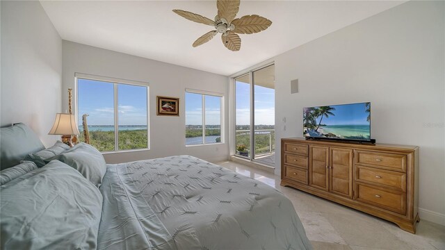 bedroom featuring ceiling fan and access to outside