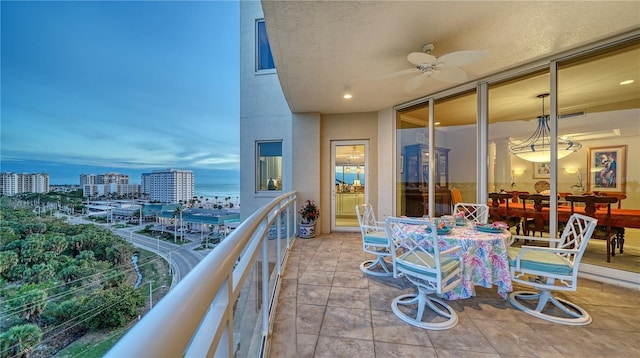 balcony at dusk with ceiling fan