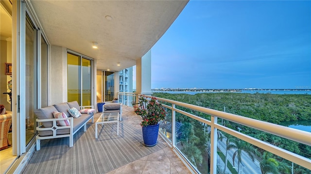 balcony featuring a water view