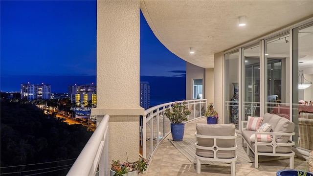 view of balcony at twilight