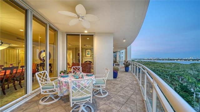 balcony at dusk with ceiling fan