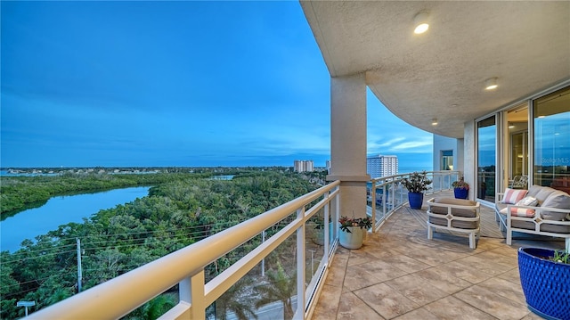 balcony featuring a water view