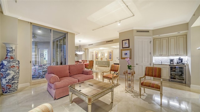 living room with ornamental molding and wine cooler