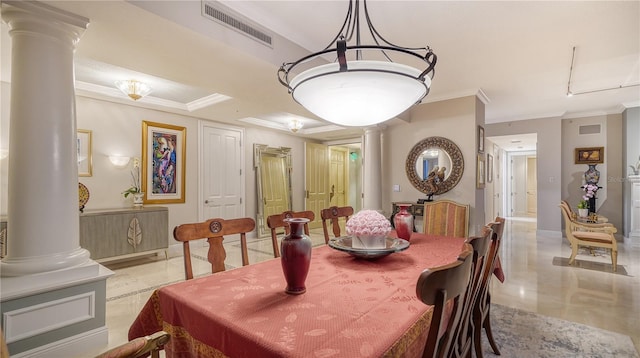 dining area featuring crown molding and ornate columns