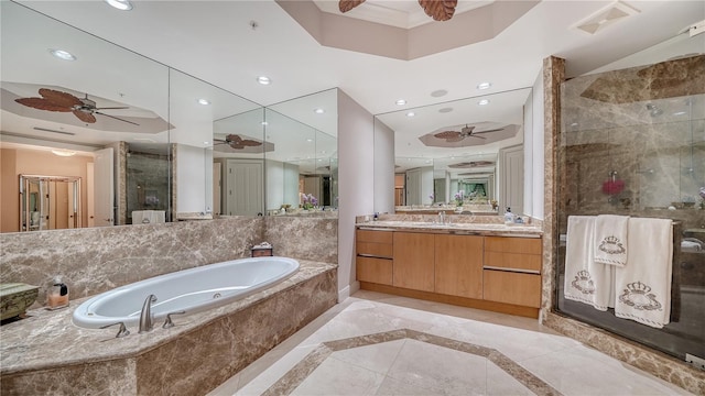 bathroom with independent shower and bath, ceiling fan, and vanity