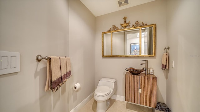 bathroom featuring toilet and tile patterned floors