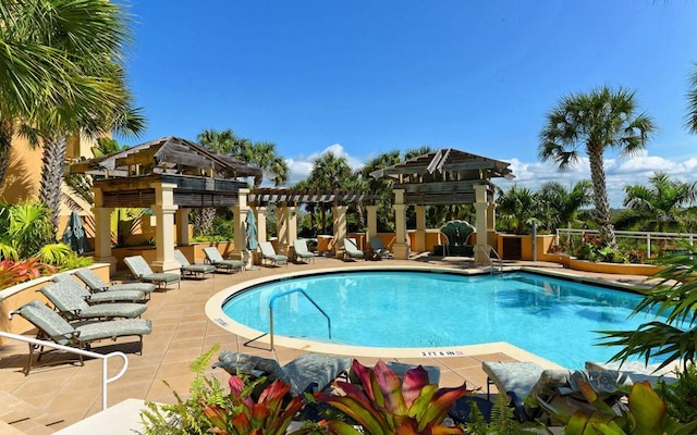 view of swimming pool with a patio area, a gazebo, and a pergola