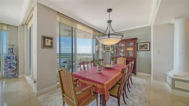 dining area with decorative columns and crown molding